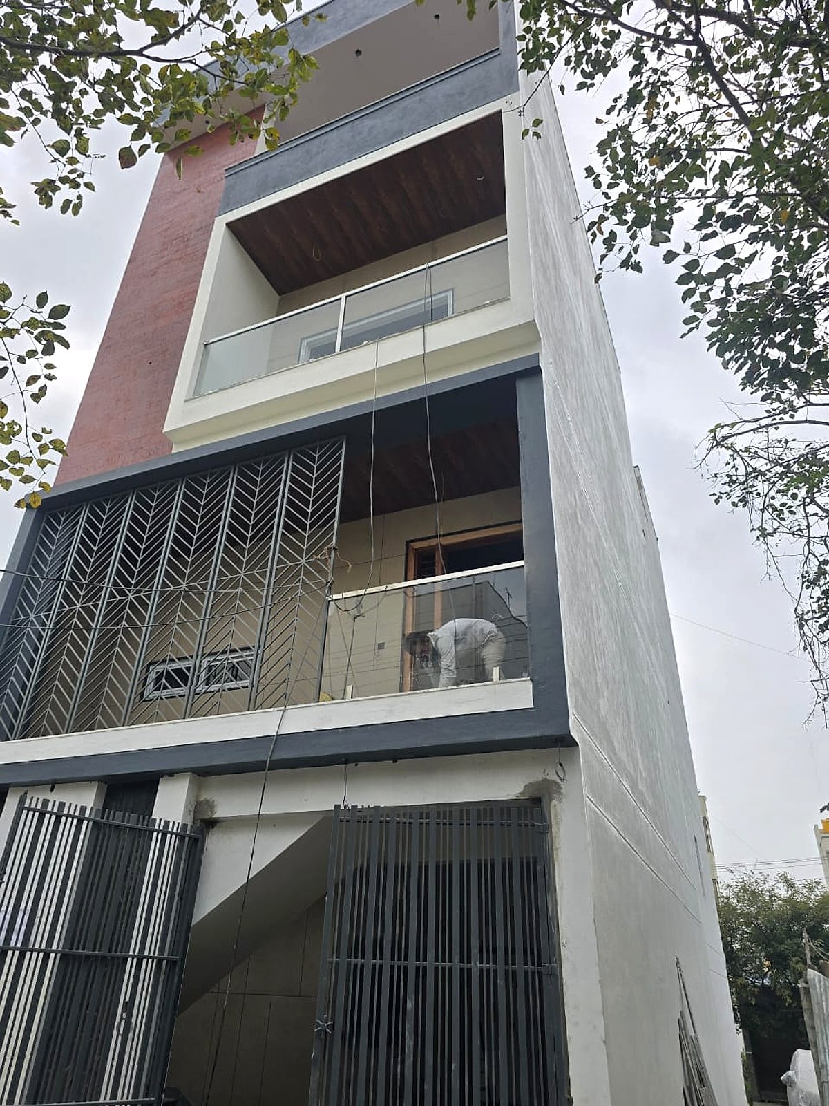 Balcony glass, grille behind