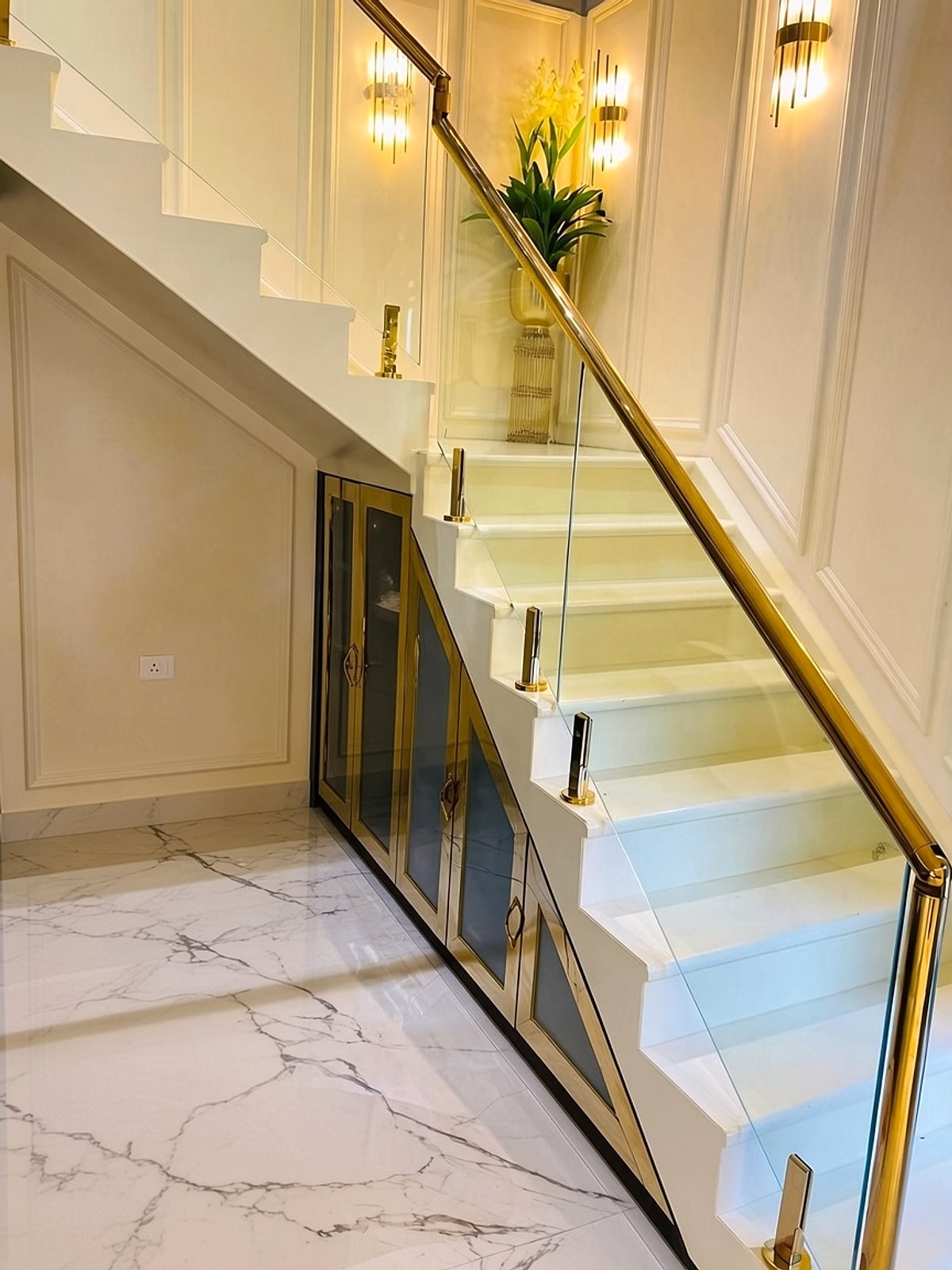 Gold handrail, glass stair