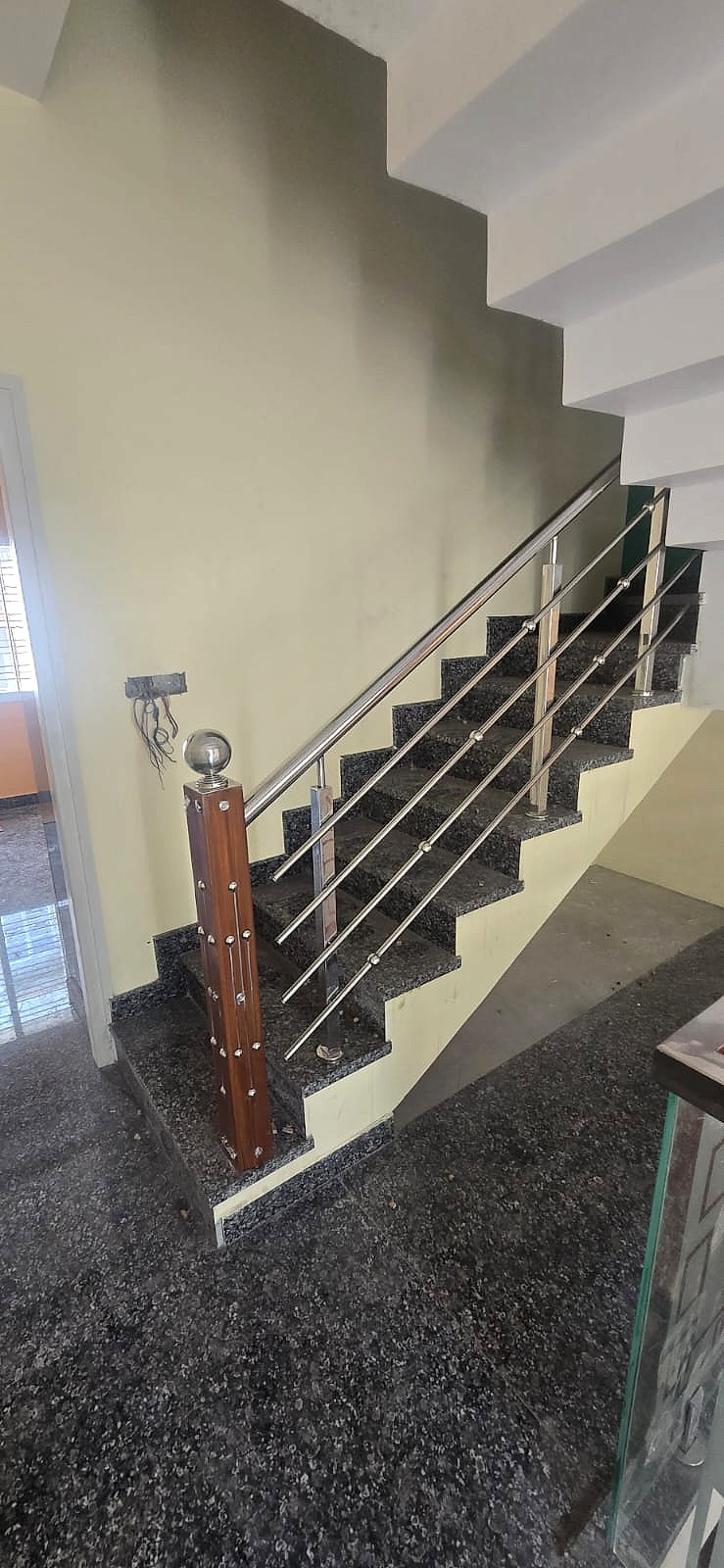 Wood newel, black stair