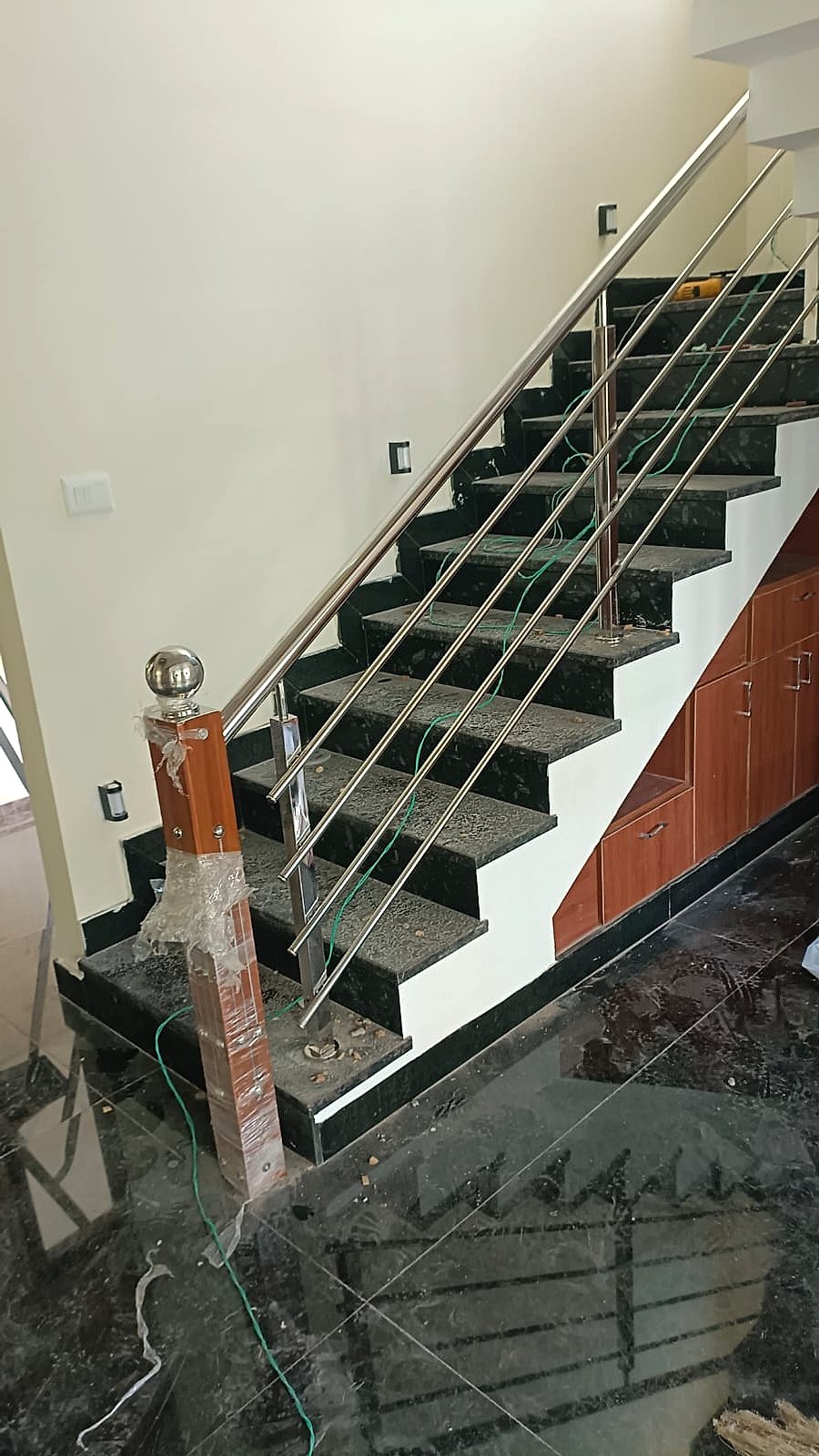 Wood newel, green stair